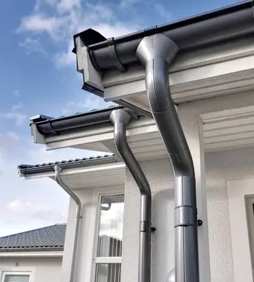 Металлический водосток: надёжная защита дома от влаги